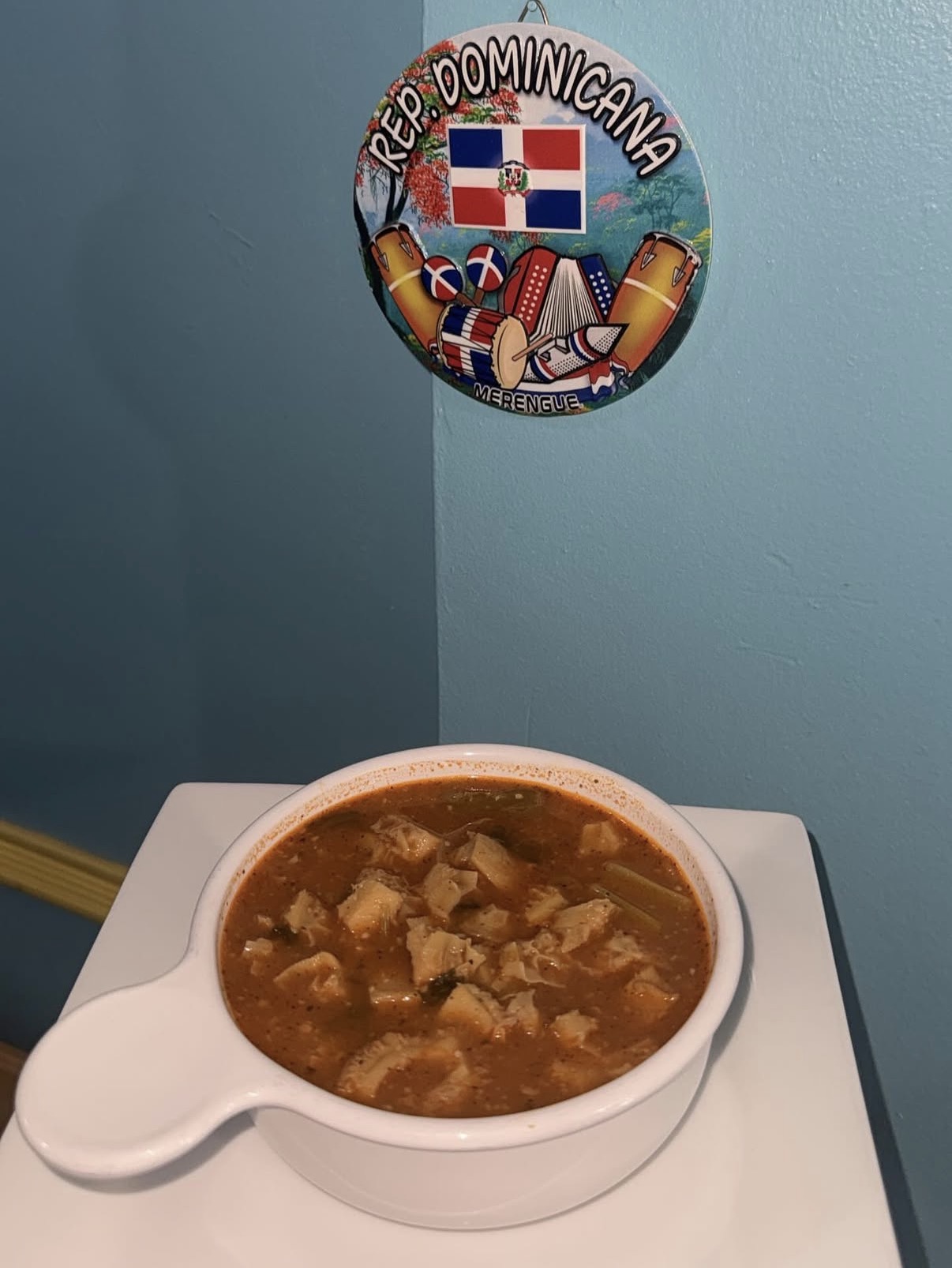 Mondongo soup with Dominican wall plaque