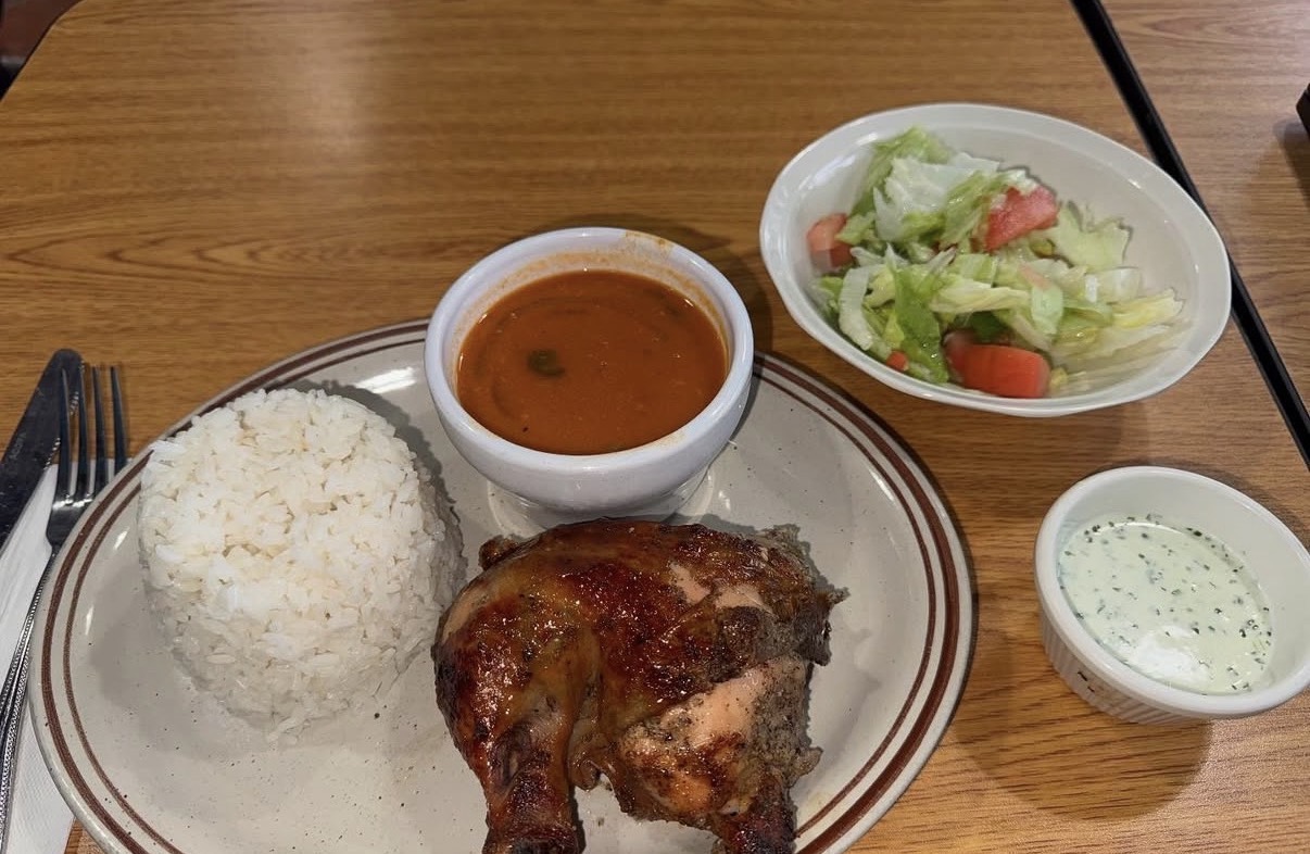 Pollo Horneado plate with rice, beans, and salad