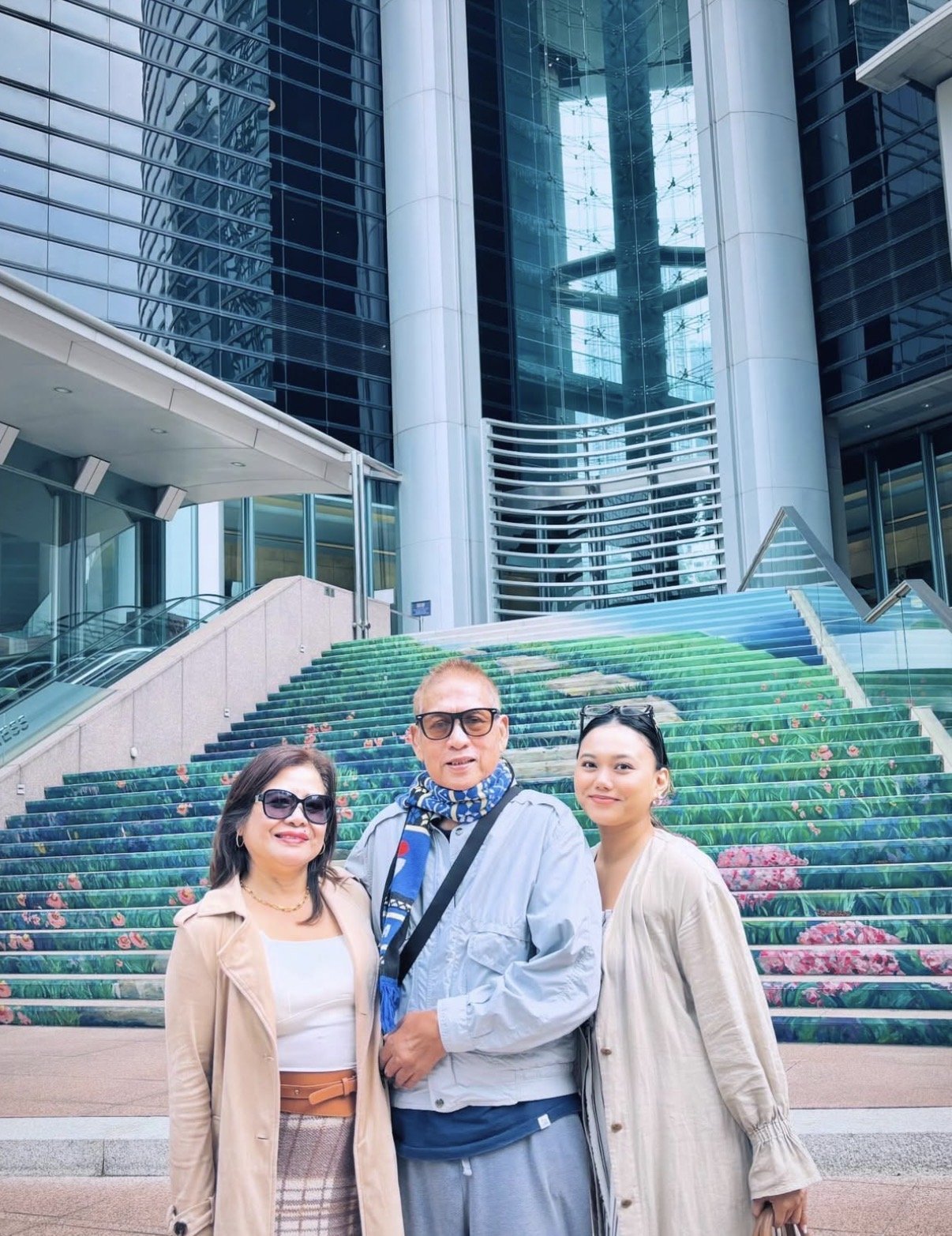 Angie with her parents in Hong Kong