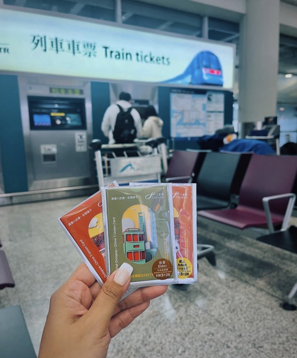 Octopus and China T-Union train cards held up at Hong Kong's airport train station