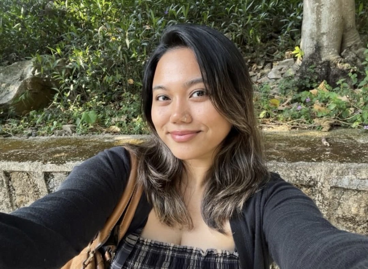 Angie Yumul, smiling outdoors